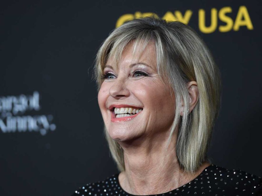 Olivia Newton-John at a red carpet before she passed away.