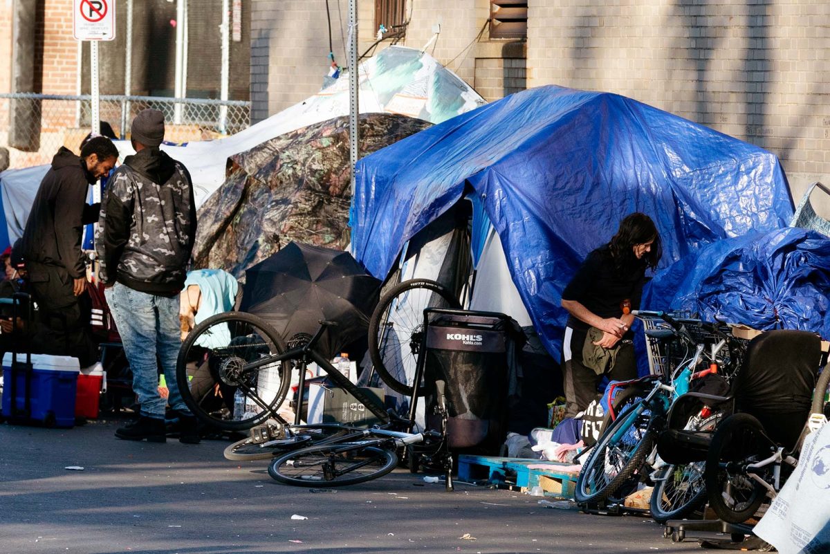 Homeless people living on the side of the street in the US.