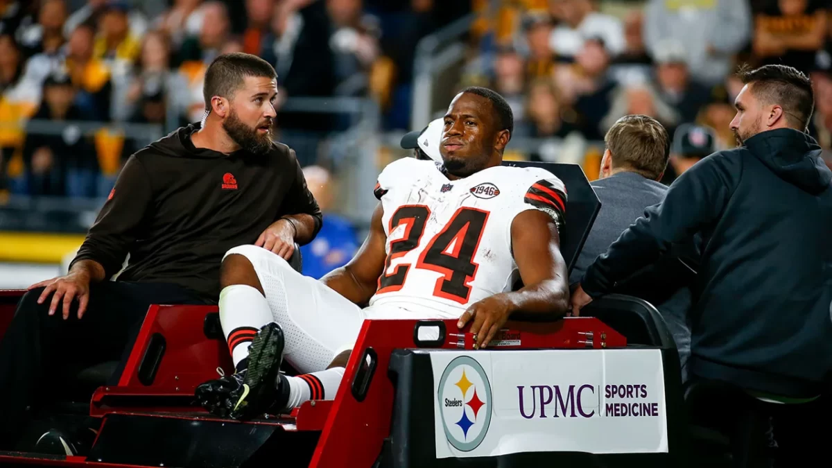 Running back Nick Chubb being carted off the field after season-ending injury.