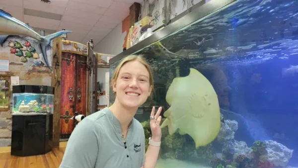 Aquarium and Shark Lab by Team ECCO assistant director Kinsley Boyette poses with Charlotte, a stingray that is about to give birth through parthenogenesis