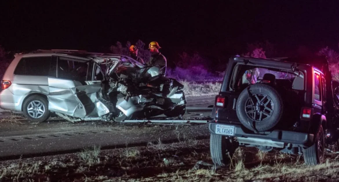 Emergency responders at the scene of a fatal two-car crash on a rural road in San Bernardino County